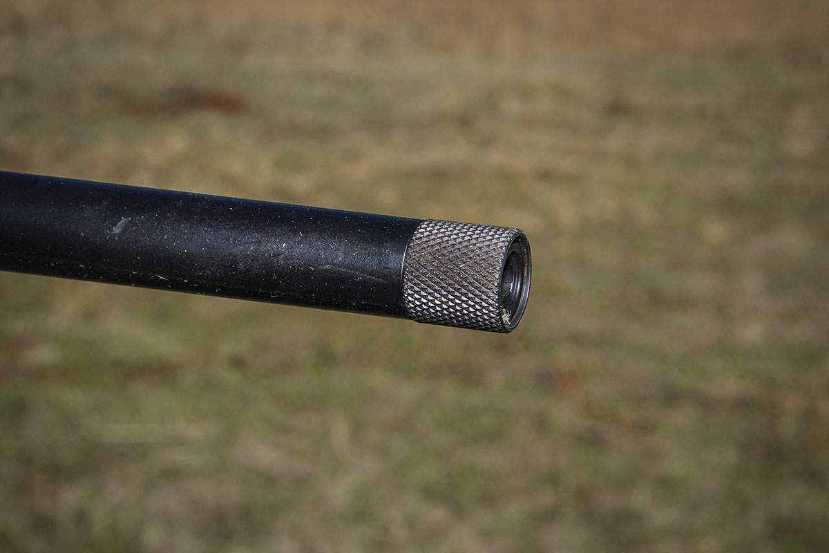 The sporter-weight barrel is threaded 9⁄16x24 to accept a brake or suppressor. A knurled thread protector is supplied.